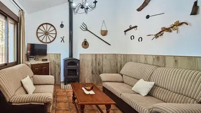a living room with two couches and a table at Chalet La Raya Conil de la Frontera by Ruralidays in Conil de la Frontera