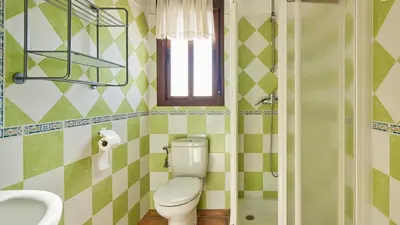 a bathroom with a toilet and a sink at Chalet La Raya Conil de la Frontera by Ruralidays in Conil de la Frontera
