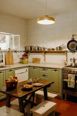 a kitchen with a table with a bowl of fruit on it at Dehesa de las Yeguas casa en finca privada con piscina y playa in Cádiz