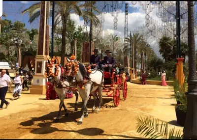 a group of people riding in a horse drawn carriage at Sherryflat C/Larga in Jerez de la Frontera