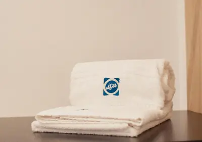 a stack of white towels sitting on a table at ISA Cádiz Palacio de Congresos in Cádiz