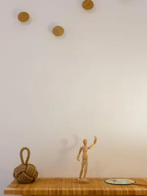 a wooden doll standing on a shelf next to a rope at The QUEEN's Designer Apartment by Cadiz4Rentals in Cádiz