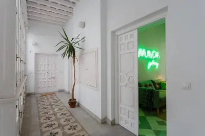 a room with a door with a palm tree in it at The QUEEN's Designer Apartment by Cadiz4Rentals in Cádiz