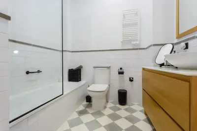 a bathroom with a toilet and a sink and a tub at The QUEEN's Designer Apartment by Cadiz4Rentals in Cádiz