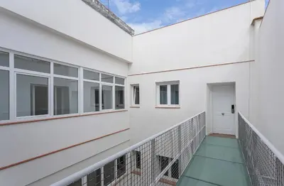 a balcony of a white building with a white door at Doña Blanca Centro Diseño Minimalista in Jerez de la Frontera