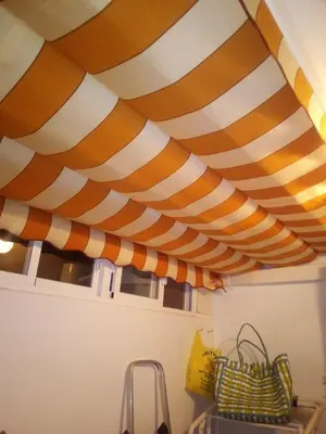 a room with a striped ceiling in a kitchen at Primera línea de playa casita adosada in Chiclana de la Frontera