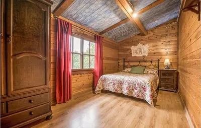 a bedroom with a bed and a dresser and a window at Beautiful Home In Arcos De La Frontera in Arcos de la Frontera