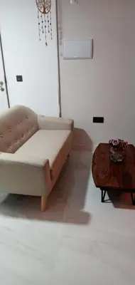 a living room with a couch and a table at ESTUDIO Jacuzzi SOL De JEREZ in Jerez de la Frontera