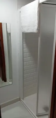 a shower in a bathroom with a mirror at ESTUDIO Jacuzzi SOL De JEREZ in Jerez de la Frontera