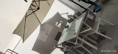 an overhead view of a staircase with an umbrella at Chipiona Santuario de Regla Playa Bajo A in Chipiona