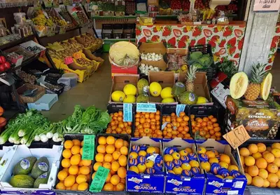 a display of fruits and vegetables in a market at Chipiona Santuario de Regla Playa Bajo A in Chipiona