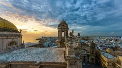 a view of a city with a clock tower at El Ático de Botica in Cádiz