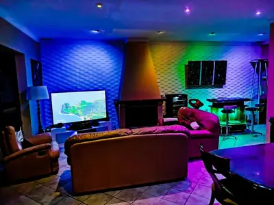 a living room with a couch and a tv at The Magic House in El Puerto de Santa María