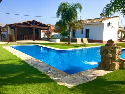 a swimming pool in the yard of a house at EL ALAZAN in Chiclana de la Frontera
