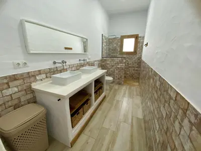 a bathroom with two sinks and a mirror at TURQUETA in Chiclana de la Frontera