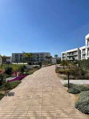a walking path in front of a building at LyriosHomes Luxury Costa Ballena Beach in Chipiona