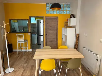 a kitchen and dining room with a table and chairs at PRECIOUS AND ORIGINAL APARTMENT CENTER in Cádiz