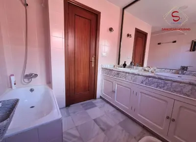 a bathroom with two sinks and a tub and a large mirror at Casa Hermosilla con piscina by Sanlúcar Housing in Sanlúcar de Barrameda