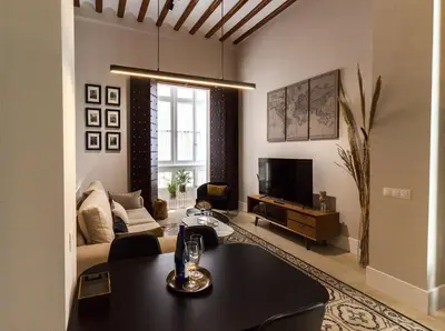 a living room with a table and a couch at Casa Mariana - Luxury Apartment - 4 Personas in Cádiz