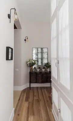 a hallway with a mirror and a dresser in a room at Casa Mariana - Luxury Apartment - 4 Personas in Cádiz