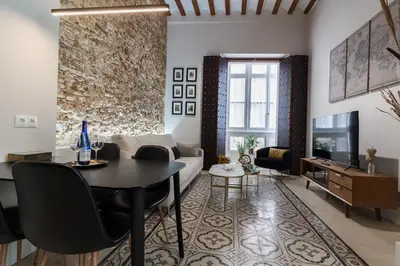 a living room with a table and a couch at Casa Mariana - Luxury Apartment - 4 Personas in Cádiz