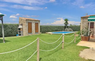 a ping pong table in the yard of a house at Chalet Piedra in Conil de la Frontera