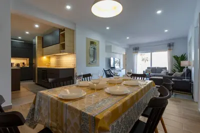 a dining room and kitchen with a table and chairs at MAREAS Family Home by Cadiz4Rentals in Cádiz