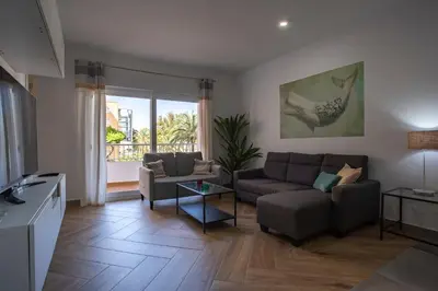 a living room with a couch and a table at MAREAS Family Home by Cadiz4Rentals in Cádiz