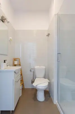 a bathroom with a toilet and a sink and a shower at MAREAS Family Home by Cadiz4Rentals in Cádiz