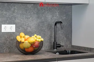 a bowl of fruit on a counter next to a sink at Bodega Mar - Velo de Flor in Sanlúcar de Barrameda