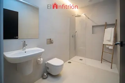 a bathroom with a sink and a toilet and a shower at Bodega Mar - Solera in Sanlúcar de Barrameda