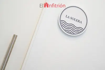 a sign for a la solera sign on a wall at Bodega Mar - Solera in Sanlúcar de Barrameda