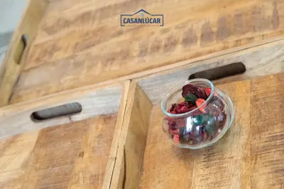 a bowl of candy sitting on top of a wooden drawer at Apartamento Diego Benitez in Sanlúcar de Barrameda