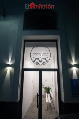 a door to a building with a sign on it at Bodega Mar - Manzanilla in Sanlúcar de Barrameda