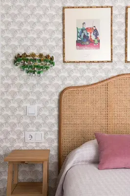 a bedroom with a bed and a picture on the wall at Sol de Sanlúcar Ático centro Parking incluido in Sanlúcar de Barrameda