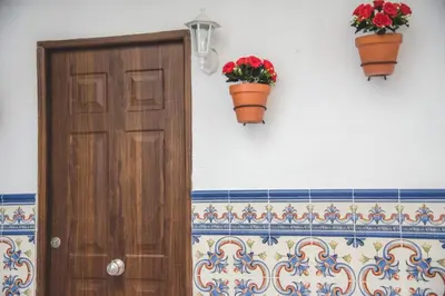 a clock on the wall of a bathroom with a toilet at Apartamento Me'ncanta Jeré in Jerez de la Frontera