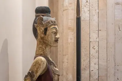 a wooden statue of a person holding a spear at Cádiz Bahía by QHotels in Cádiz