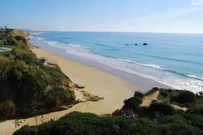 a view of a beach next to the ocean at Casa Levante en playa Fuente del Gallo in Conil de la Frontera