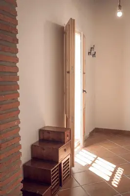 a room with stairs and a door with a window at Apartamento Doña Lola in Jerez de la Frontera