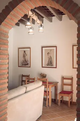 a living room with a couch and a table at Apartamento Doña Lola in Jerez de la Frontera