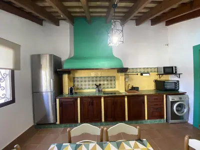a kitchen with a sink and a stove at SUMATRA in Chiclana de la Frontera
