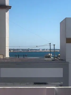 a view of a body of water from a building at Casa en primera línea de playa in Rota