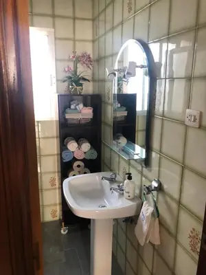 a bathroom with a sink and a mirror at Casa en primera línea de playa in Rota