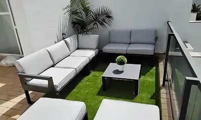 a living room with a couch and a table at Casa Lua in Conil de la Frontera