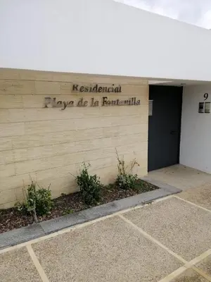 a sign on the side of a building at Casa Lua in Conil de la Frontera