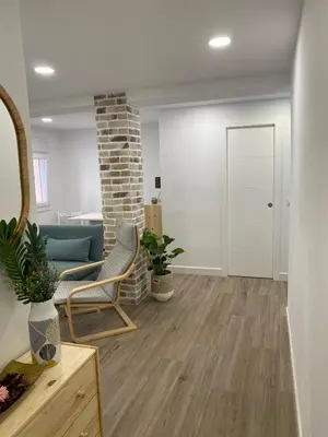 a living room with a couch and a table at Playa Apartamento Lidia in Cádiz