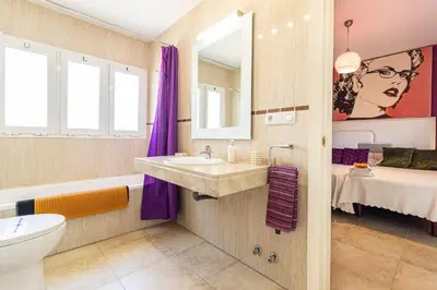 a bathroom with a sink and a toilet at Mirador del Sur Penthouse & SunSet - Free Parking in Jerez de la Frontera