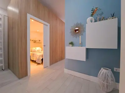 a room with a door leading to a bedroom at Apartamento Barrosa Pista in Chiclana de la Frontera