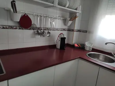 a kitchen with a sink and a counter top at La Terraza de Natipao in Rota