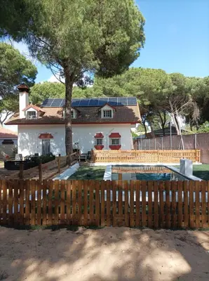 a house with a wooden fence in front of it at Casa Selene in El Puerto de Santa María